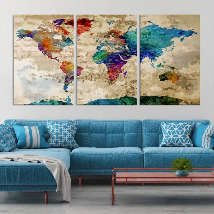 The contemporary living room showcases the "Watercolor Wall Art Push Pin World Map w/ Antarctica Canvas Print" on the wall. This museum-quality canvas is equipped with a UV-protective coating, guaranteeing vibrant colors endure for years, and it's ready to hang for an immediate style enhancement.