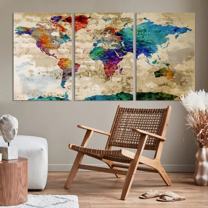 The contemporary living room showcases the "Watercolor Wall Art Push Pin World Map w/ Antarctica Canvas Print" on the wall. This museum-quality canvas is equipped with a UV-protective coating, guaranteeing vibrant colors endure for years, and it's ready to hang for an immediate style enhancement.