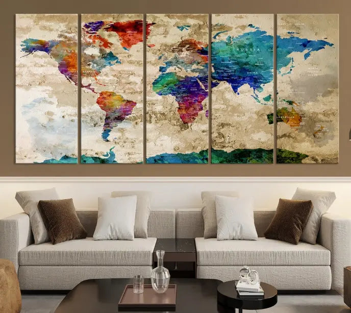 The contemporary living room showcases the "Watercolor Wall Art Push Pin World Map w/ Antarctica Canvas Print" on the wall. This museum-quality canvas is equipped with a UV-protective coating, guaranteeing vibrant colors endure for years, and it's ready to hang for an immediate style enhancement.