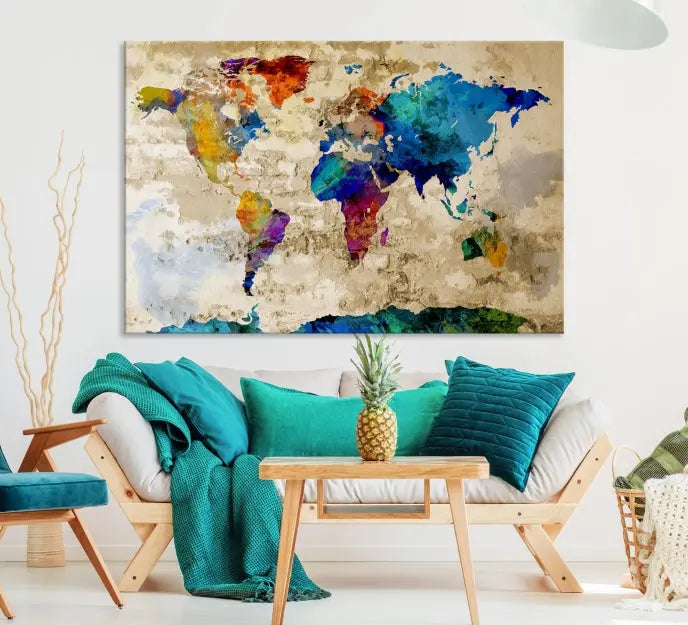 A three-panel "Watercolor Wall Art World Map w/ Antarctica Canvas Print" on museum-quality canvas features vibrant colors and is ready to hang in a dimly lit living room.