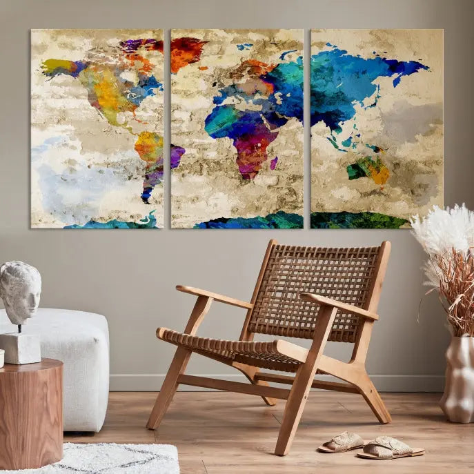 A three-panel "Watercolor Wall Art World Map w/ Antarctica Canvas Print" on museum-quality canvas features vibrant colors and is ready to hang in a dimly lit living room.