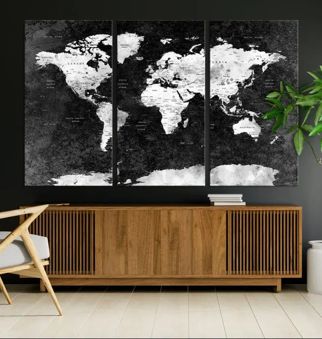 The Push Pin World Map with Antarctica Canvas Wall Art Print, featuring a UV-protective coating, hangs prominently in the room.