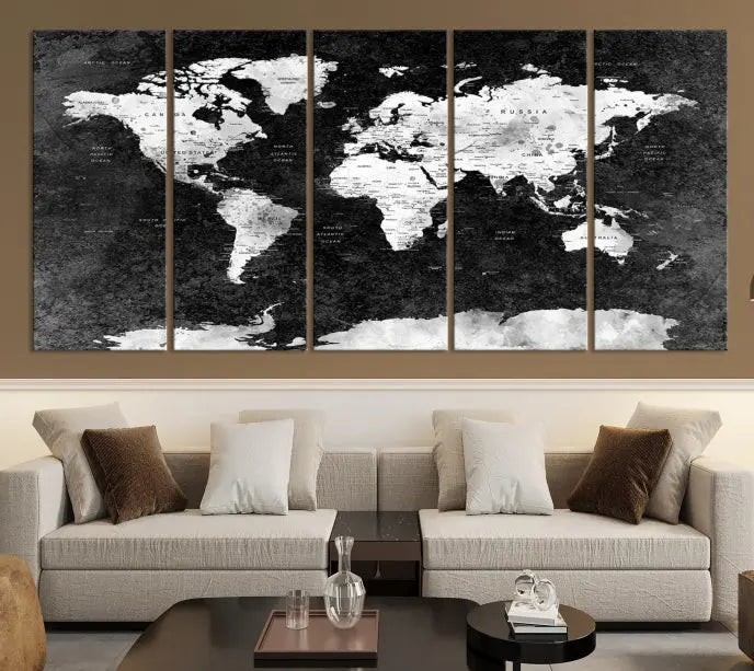 The Push Pin World Map with Antarctica Canvas Wall Art Print, featuring a UV-protective coating, hangs prominently in the room.