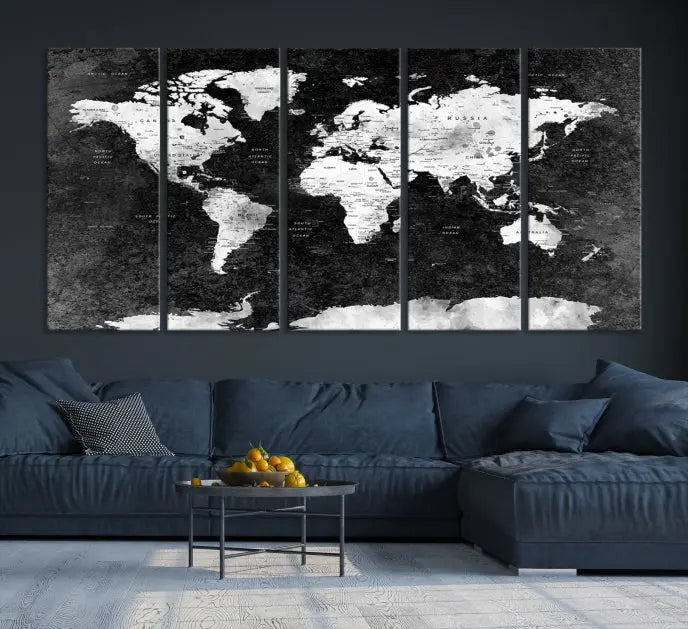 The Push Pin World Map with Antarctica Canvas Wall Art Print, featuring a UV-protective coating, hangs prominently in the room.