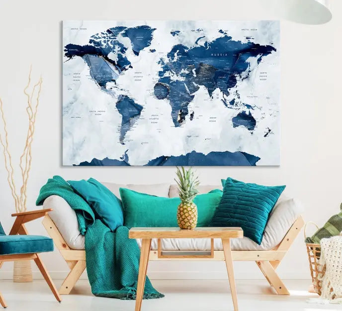 The Navy Blue World Map with Antarctica Wall Art Canvas Print, featuring a stunning blend of blue and white on a museum-quality canvas, elegantly adorns a dark wall. This ready-to-hang masterpiece enhances the room's sophisticated ambiance.