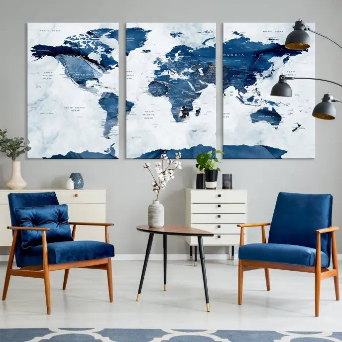 The Navy Blue World Map with Antarctica Wall Art Canvas Print, featuring a stunning blend of blue and white on a museum-quality canvas, elegantly adorns a dark wall. This ready-to-hang masterpiece enhances the room's sophisticated ambiance.