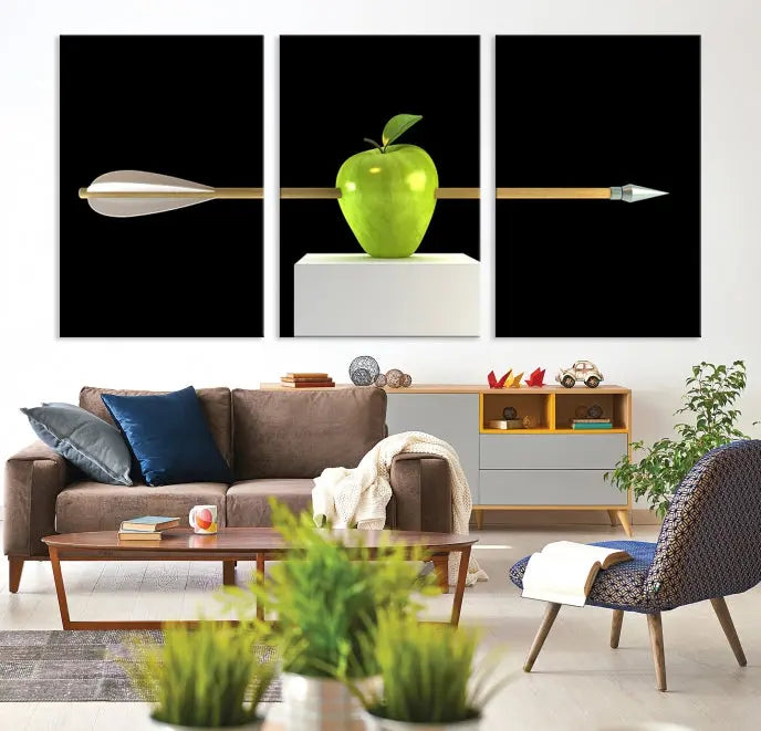 The "Apple and Arrow Wall Art Apple Illustr Canvas Print" is a triptych art piece depicting an arrow through a green apple on a black background. This gallery-wrapped artwork, printed on museum-quality canvas, ensures vibrancy and durability.