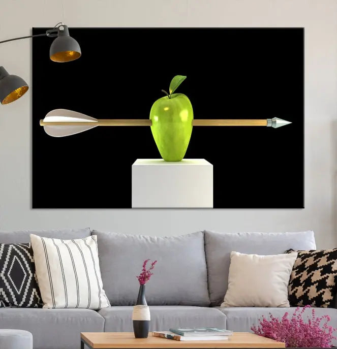 The "Apple and Arrow Wall Art Apple Illustr Canvas Print" is a triptych art piece depicting an arrow through a green apple on a black background. This gallery-wrapped artwork, printed on museum-quality canvas, ensures vibrancy and durability.