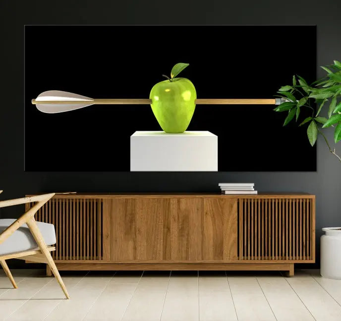 The "Apple and Arrow Wall Art Apple Illustr Canvas Print" is a triptych art piece depicting an arrow through a green apple on a black background. This gallery-wrapped artwork, printed on museum-quality canvas, ensures vibrancy and durability.