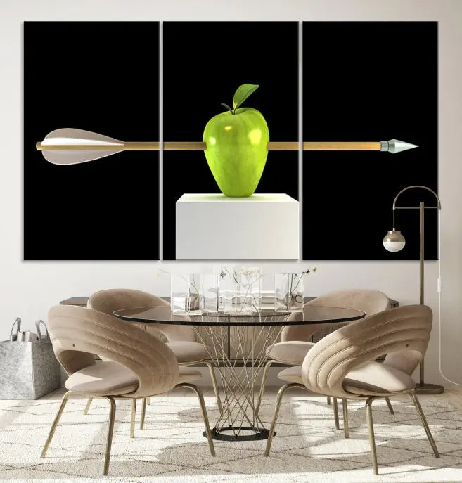 The "Apple and Arrow Wall Art Apple Illustr Canvas Print" is a triptych art piece depicting an arrow through a green apple on a black background. This gallery-wrapped artwork, printed on museum-quality canvas, ensures vibrancy and durability.