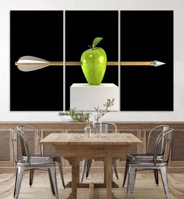 The "Apple and Arrow Wall Art Apple Illustr Canvas Print" is a triptych art piece depicting an arrow through a green apple on a black background. This gallery-wrapped artwork, printed on museum-quality canvas, ensures vibrancy and durability.