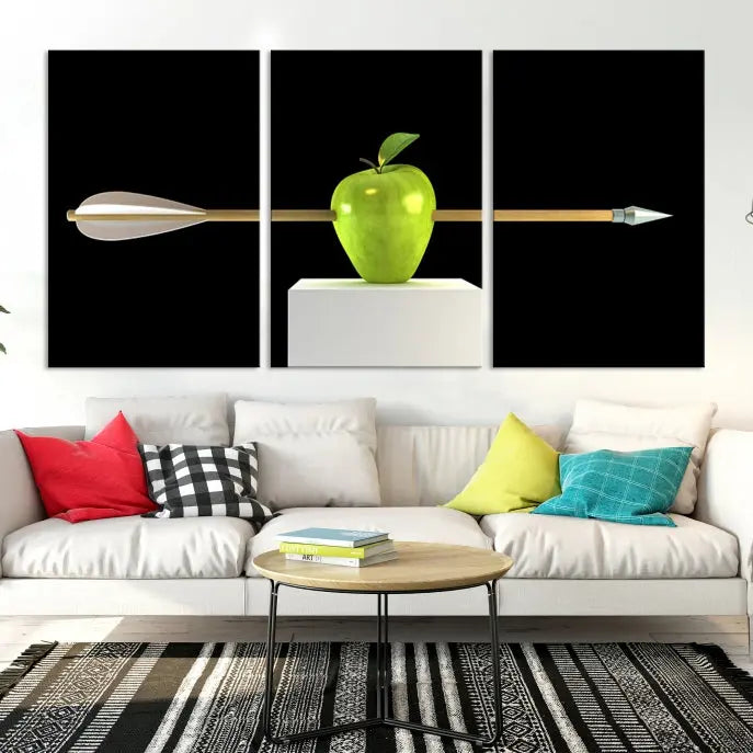 The "Apple and Arrow Wall Art Apple Illustr Canvas Print" is a triptych art piece depicting an arrow through a green apple on a black background. This gallery-wrapped artwork, printed on museum-quality canvas, ensures vibrancy and durability.