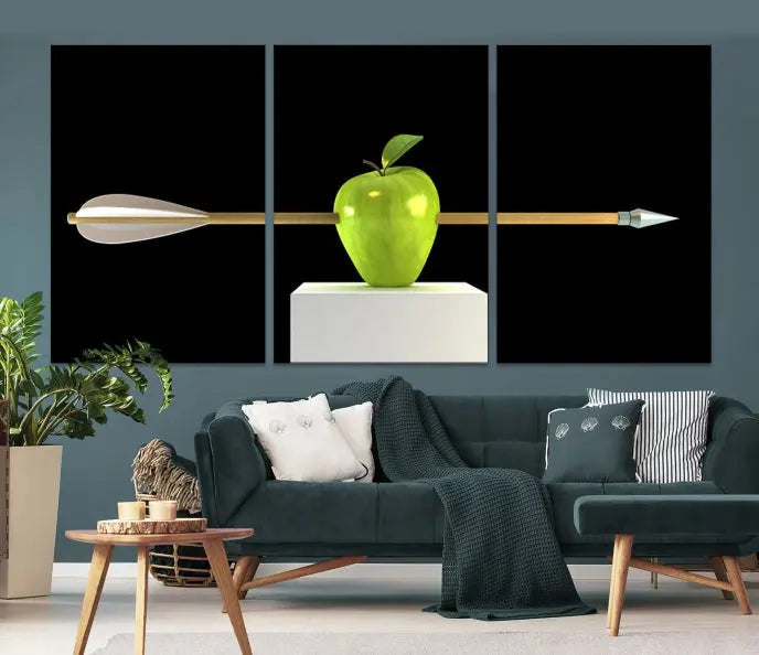 The "Apple and Arrow Wall Art Apple Illustr Canvas Print" is a triptych art piece depicting an arrow through a green apple on a black background. This gallery-wrapped artwork, printed on museum-quality canvas, ensures vibrancy and durability.