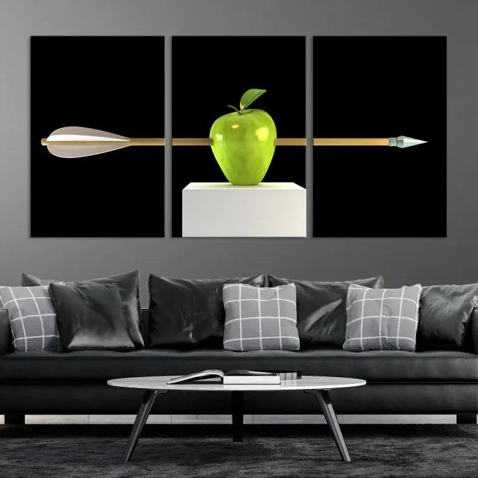 The "Apple and Arrow Wall Art Apple Illustr Canvas Print" is a triptych art piece depicting an arrow through a green apple on a black background. This gallery-wrapped artwork, printed on museum-quality canvas, ensures vibrancy and durability.