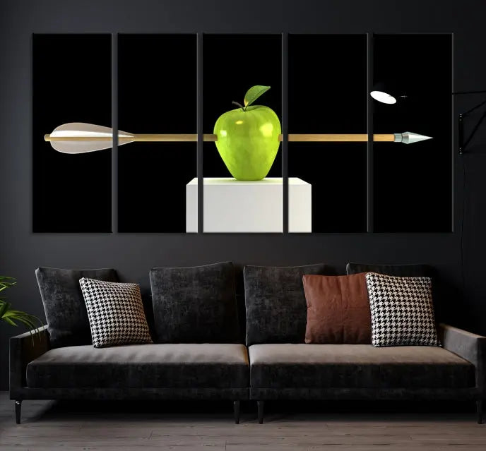 The "Apple and Arrow Wall Art Apple Illustr Canvas Print" is a triptych art piece depicting an arrow through a green apple on a black background. This gallery-wrapped artwork, printed on museum-quality canvas, ensures vibrancy and durability.