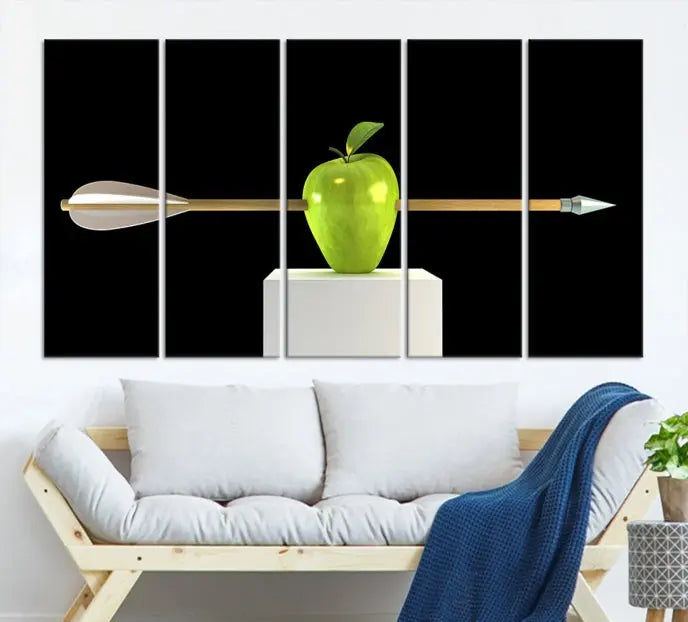 The "Apple and Arrow Wall Art Apple Illustr Canvas Print" is a triptych art piece depicting an arrow through a green apple on a black background. This gallery-wrapped artwork, printed on museum-quality canvas, ensures vibrancy and durability.