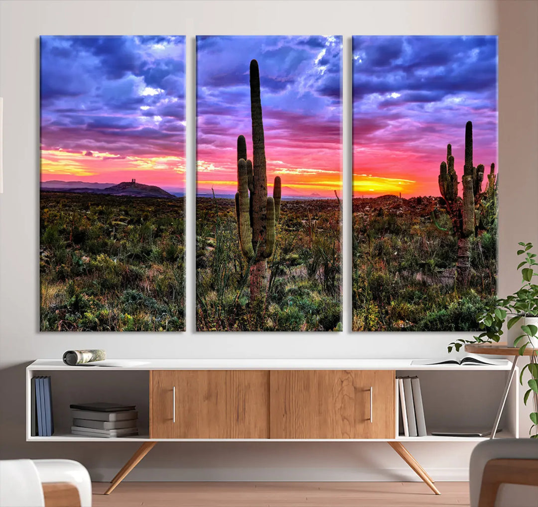 The Arizona Desert Sunset Wall Art Canvas Print features a triptych of a desert landscape with saguaro cacti, a vibrant sunset, and a cloudy sky. This stunning piece is crafted using high-resolution printing on museum-quality canvas, ensuring every detail is captured beautifully.