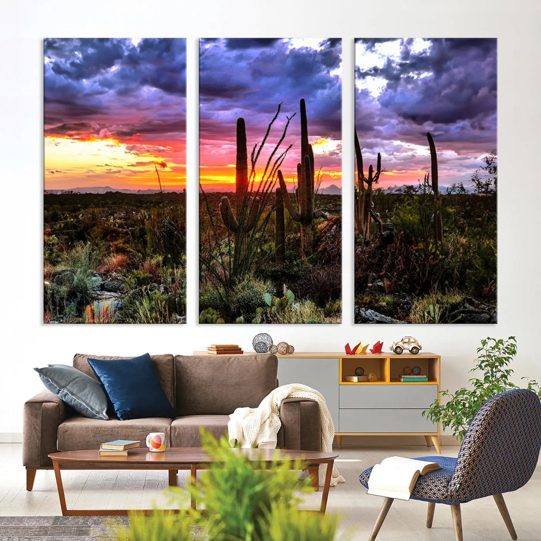 The Arizona Desert Sunset Wall Art Canvas Print, featuring a three-panel design with a desert landscape at sunset, is gallery wrapped for a modern living room. This museum-quality canvas showcases high-resolution printing.