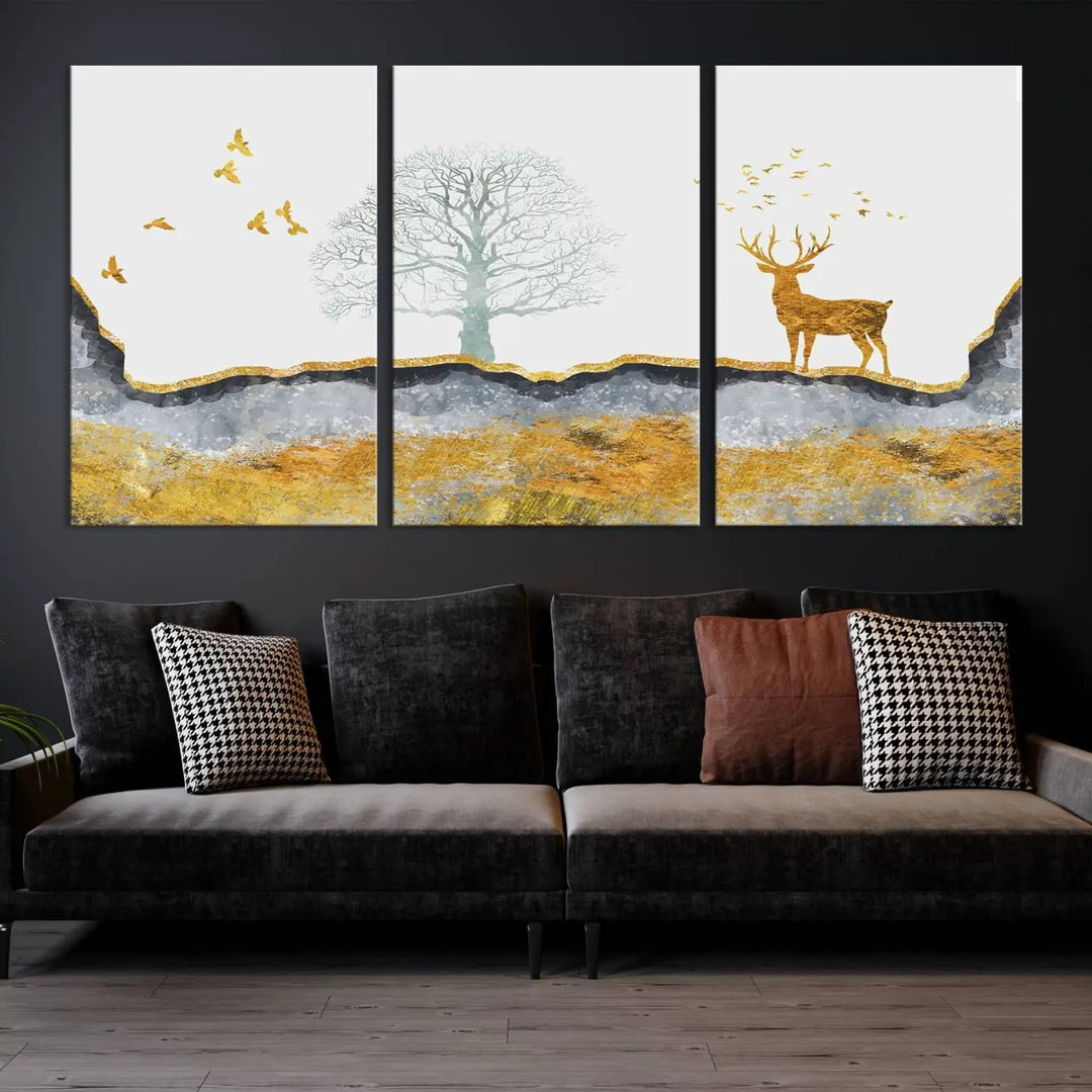 The dark gray wall is adorned with a triptych featuring a tree, birds, and a stag. This piece, titled "Artistic Deer Painting Wall Art Canvas Print Animal Wall Art Deer Art Print," is crafted as gallery-wrapped art from museum-quality polycotton and features a UV-protective coating to preserve its vibrant display.