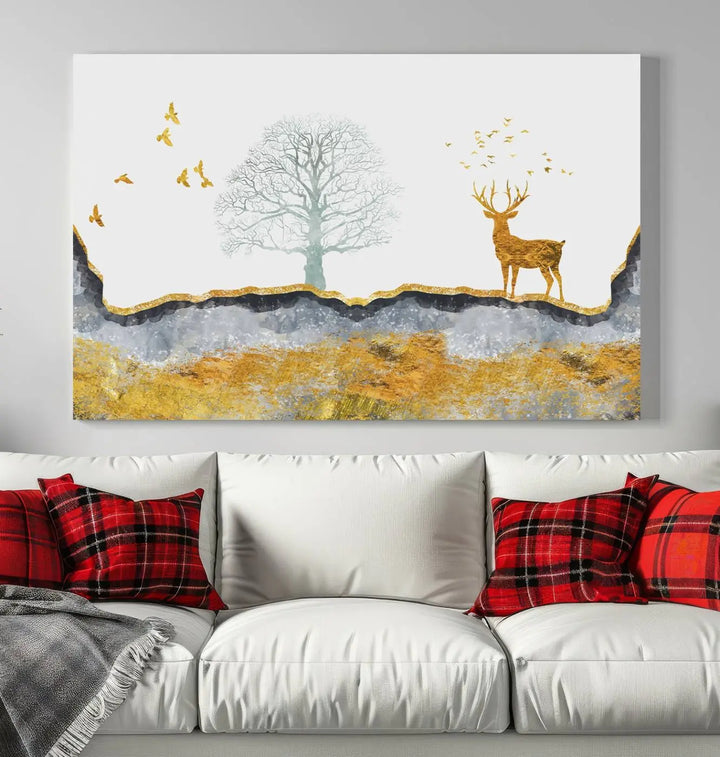 The dark gray wall is adorned with a triptych featuring a tree, birds, and a stag. This piece, titled "Artistic Deer Painting Wall Art Canvas Print Animal Wall Art Deer Art Print," is crafted as gallery-wrapped art from museum-quality polycotton and features a UV-protective coating to preserve its vibrant display.