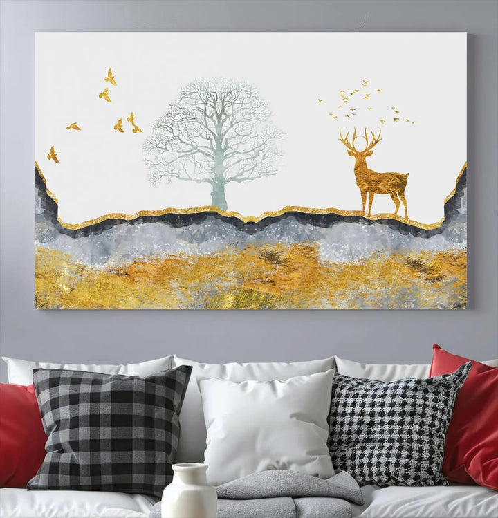 The dark gray wall is adorned with a triptych featuring a tree, birds, and a stag. This piece, titled "Artistic Deer Painting Wall Art Canvas Print Animal Wall Art Deer Art Print," is crafted as gallery-wrapped art from museum-quality polycotton and features a UV-protective coating to preserve its vibrant display.