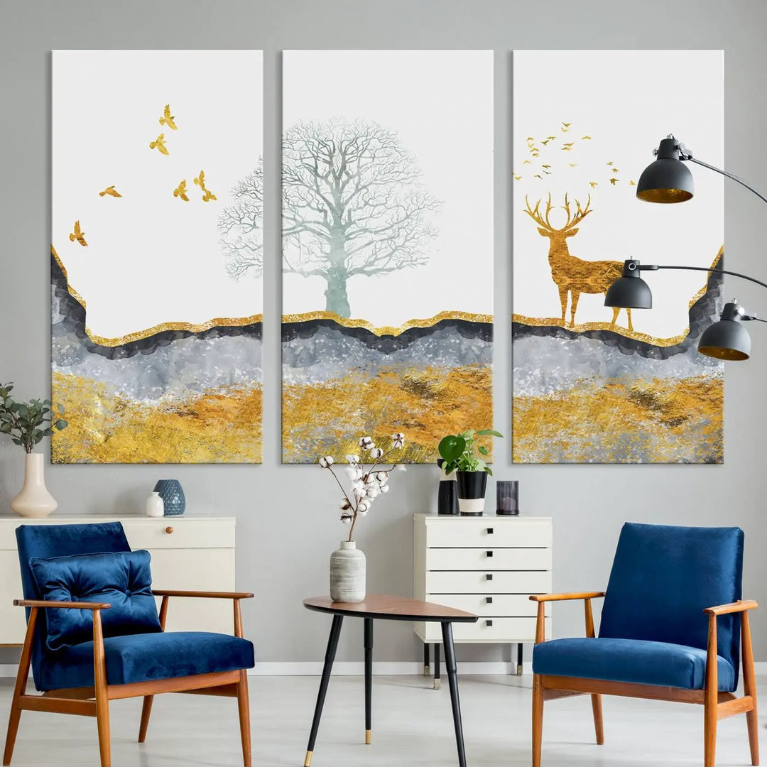 The dark gray wall is adorned with a triptych featuring a tree, birds, and a stag. This piece, titled "Artistic Deer Painting Wall Art Canvas Print Animal Wall Art Deer Art Print," is crafted as gallery-wrapped art from museum-quality polycotton and features a UV-protective coating to preserve its vibrant display.