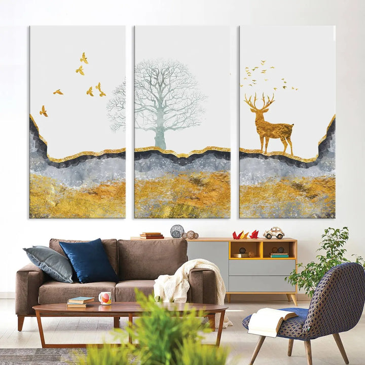 The dark gray wall is adorned with a triptych featuring a tree, birds, and a stag. This piece, titled "Artistic Deer Painting Wall Art Canvas Print Animal Wall Art Deer Art Print," is crafted as gallery-wrapped art from museum-quality polycotton and features a UV-protective coating to preserve its vibrant display.