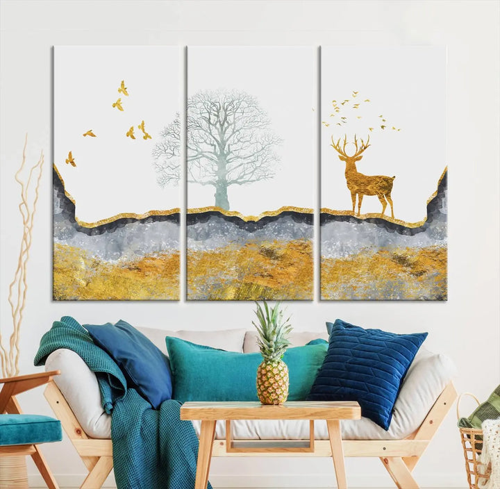 The dark gray wall is adorned with a triptych featuring a tree, birds, and a stag. This piece, titled "Artistic Deer Painting Wall Art Canvas Print Animal Wall Art Deer Art Print," is crafted as gallery-wrapped art from museum-quality polycotton and features a UV-protective coating to preserve its vibrant display.