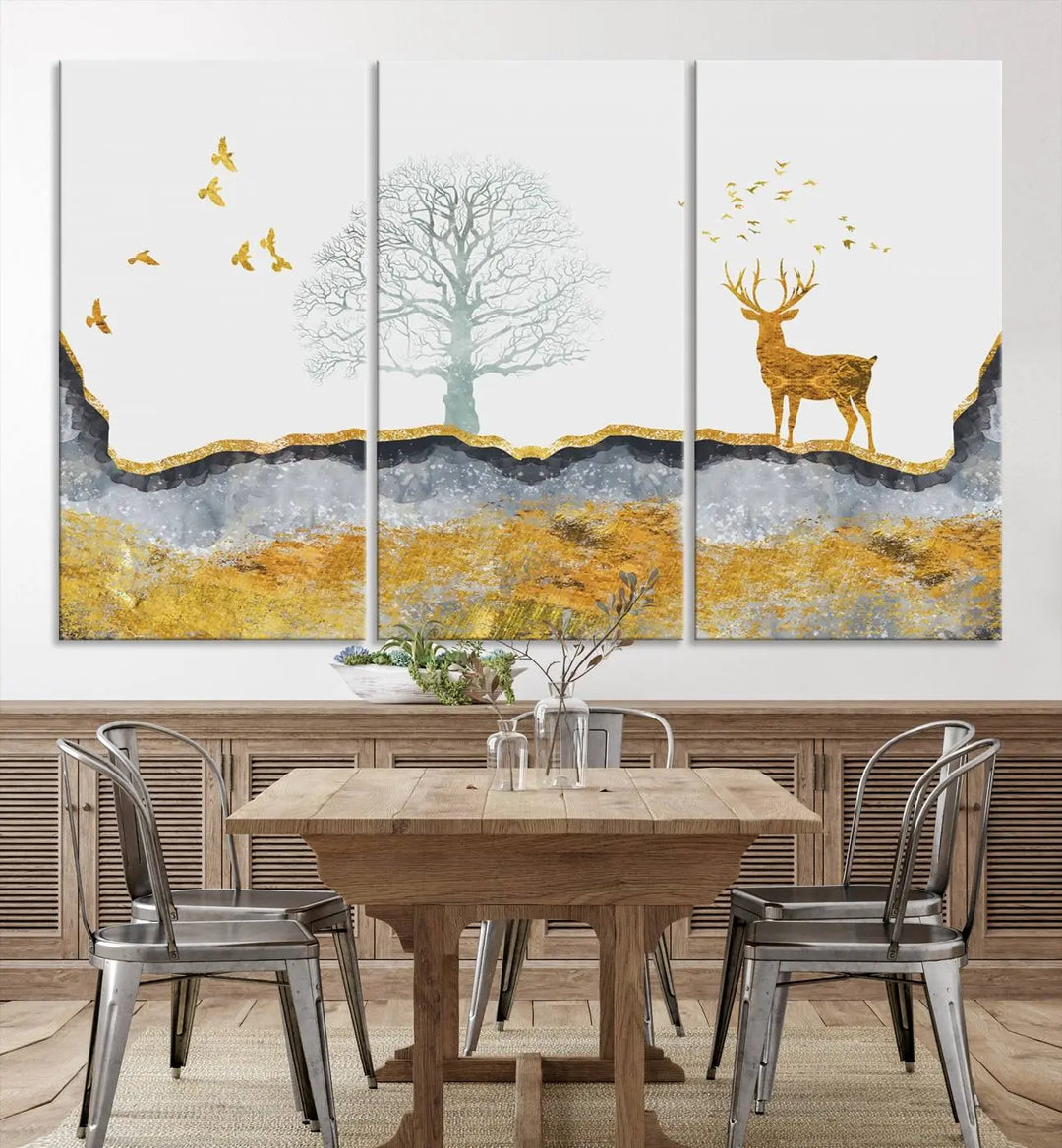 The dark gray wall is adorned with a triptych featuring a tree, birds, and a stag. This piece, titled "Artistic Deer Painting Wall Art Canvas Print Animal Wall Art Deer Art Print," is crafted as gallery-wrapped art from museum-quality polycotton and features a UV-protective coating to preserve its vibrant display.