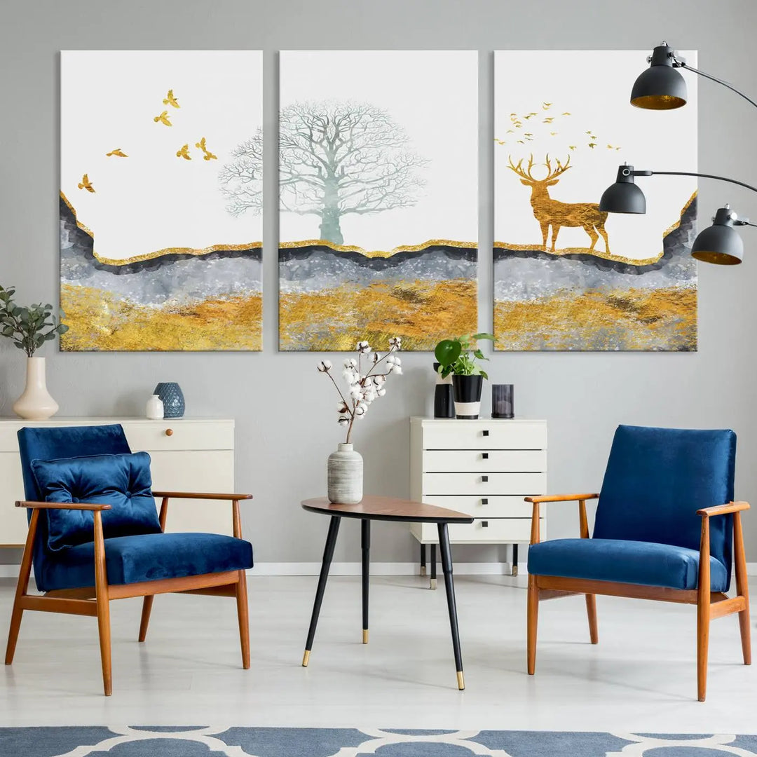 The dark gray wall is adorned with a triptych featuring a tree, birds, and a stag. This piece, titled "Artistic Deer Painting Wall Art Canvas Print Animal Wall Art Deer Art Print," is crafted as gallery-wrapped art from museum-quality polycotton and features a UV-protective coating to preserve its vibrant display.