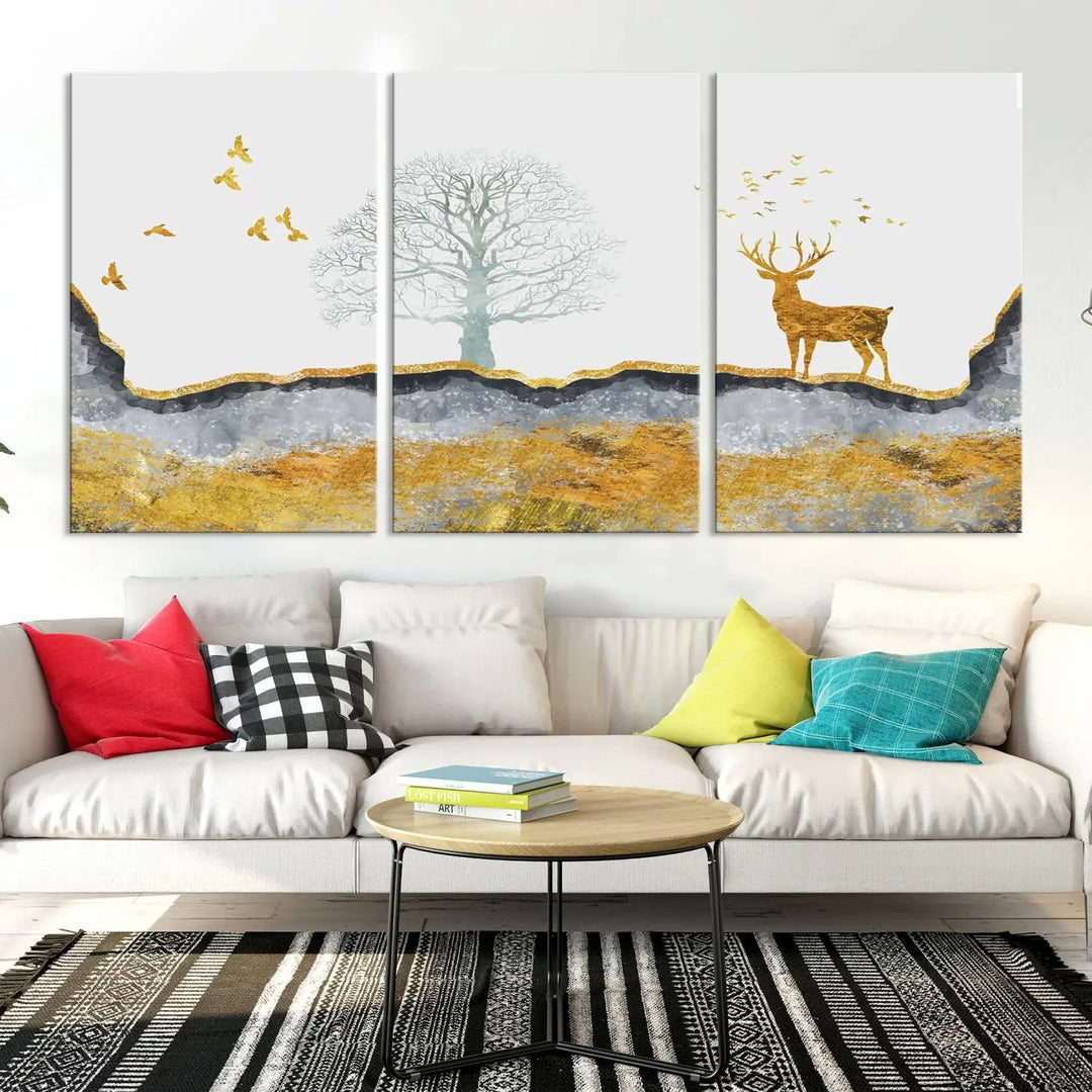 The dark gray wall is adorned with a triptych featuring a tree, birds, and a stag. This piece, titled "Artistic Deer Painting Wall Art Canvas Print Animal Wall Art Deer Art Print," is crafted as gallery-wrapped art from museum-quality polycotton and features a UV-protective coating to preserve its vibrant display.