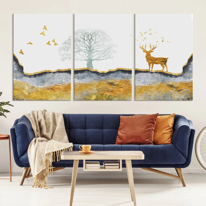 The dark gray wall is adorned with a triptych featuring a tree, birds, and a stag. This piece, titled "Artistic Deer Painting Wall Art Canvas Print Animal Wall Art Deer Art Print," is crafted as gallery-wrapped art from museum-quality polycotton and features a UV-protective coating to preserve its vibrant display.