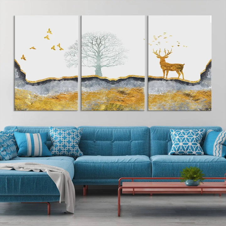 The dark gray wall is adorned with a triptych featuring a tree, birds, and a stag. This piece, titled "Artistic Deer Painting Wall Art Canvas Print Animal Wall Art Deer Art Print," is crafted as gallery-wrapped art from museum-quality polycotton and features a UV-protective coating to preserve its vibrant display.