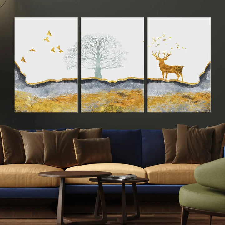 The dark gray wall is adorned with a triptych featuring a tree, birds, and a stag. This piece, titled "Artistic Deer Painting Wall Art Canvas Print Animal Wall Art Deer Art Print," is crafted as gallery-wrapped art from museum-quality polycotton and features a UV-protective coating to preserve its vibrant display.