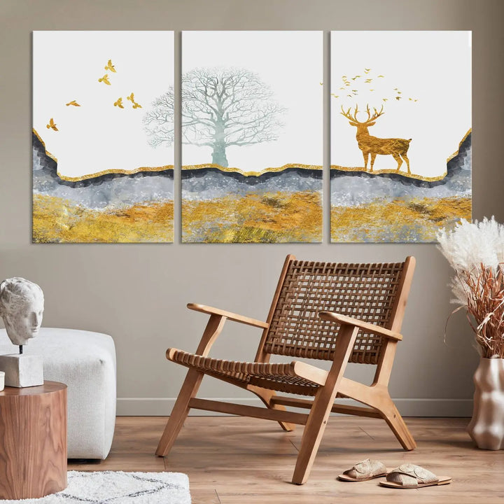 The dark gray wall is adorned with a triptych featuring a tree, birds, and a stag. This piece, titled "Artistic Deer Painting Wall Art Canvas Print Animal Wall Art Deer Art Print," is crafted as gallery-wrapped art from museum-quality polycotton and features a UV-protective coating to preserve its vibrant display.