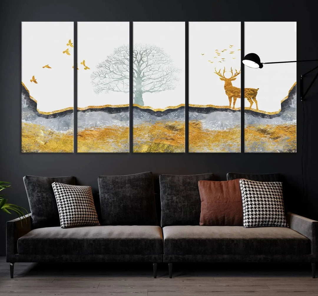 The dark gray wall is adorned with a triptych featuring a tree, birds, and a stag. This piece, titled "Artistic Deer Painting Wall Art Canvas Print Animal Wall Art Deer Art Print," is crafted as gallery-wrapped art from museum-quality polycotton and features a UV-protective coating to preserve its vibrant display.