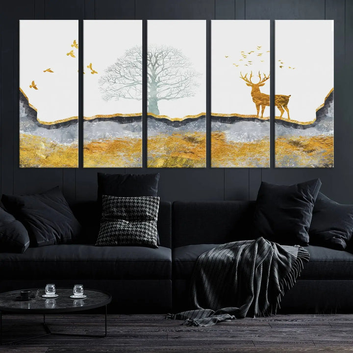 The dark gray wall is adorned with a triptych featuring a tree, birds, and a stag. This piece, titled "Artistic Deer Painting Wall Art Canvas Print Animal Wall Art Deer Art Print," is crafted as gallery-wrapped art from museum-quality polycotton and features a UV-protective coating to preserve its vibrant display.