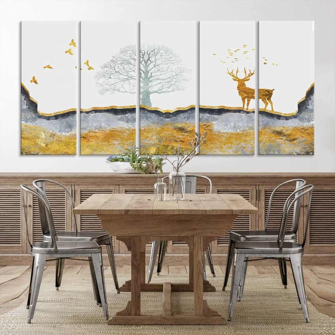 The dark gray wall is adorned with a triptych featuring a tree, birds, and a stag. This piece, titled "Artistic Deer Painting Wall Art Canvas Print Animal Wall Art Deer Art Print," is crafted as gallery-wrapped art from museum-quality polycotton and features a UV-protective coating to preserve its vibrant display.