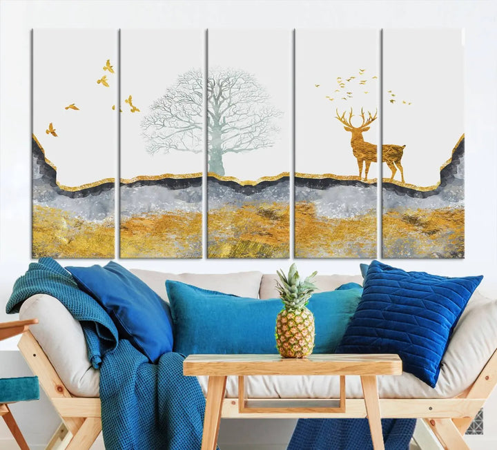 The dark gray wall is adorned with a triptych featuring a tree, birds, and a stag. This piece, titled "Artistic Deer Painting Wall Art Canvas Print Animal Wall Art Deer Art Print," is crafted as gallery-wrapped art from museum-quality polycotton and features a UV-protective coating to preserve its vibrant display.