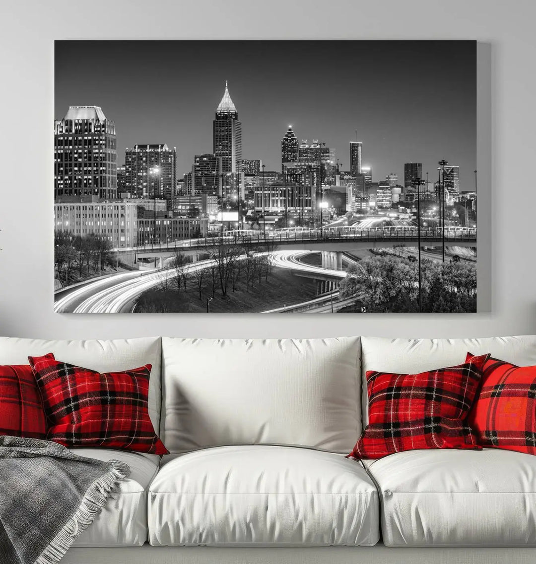 The living room is highlighted by an Atlanta Black and White Wall Art Cityscape Canvas Print that complements the black-and-white cityscape triptych on the wall, bringing an urban decor vibe to the space.