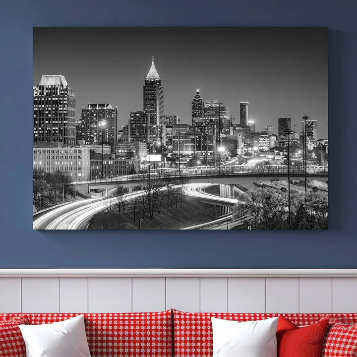 The living room is highlighted by an Atlanta Black and White Wall Art Cityscape Canvas Print that complements the black-and-white cityscape triptych on the wall, bringing an urban decor vibe to the space.