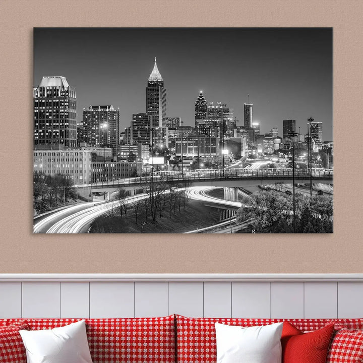 The living room is highlighted by an Atlanta Black and White Wall Art Cityscape Canvas Print that complements the black-and-white cityscape triptych on the wall, bringing an urban decor vibe to the space.