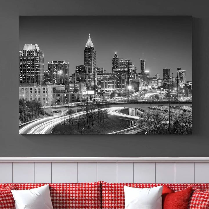 The living room is highlighted by an Atlanta Black and White Wall Art Cityscape Canvas Print that complements the black-and-white cityscape triptych on the wall, bringing an urban decor vibe to the space.