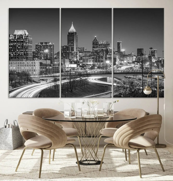 The living room is highlighted by an Atlanta Black and White Wall Art Cityscape Canvas Print that complements the black-and-white cityscape triptych on the wall, bringing an urban decor vibe to the space.