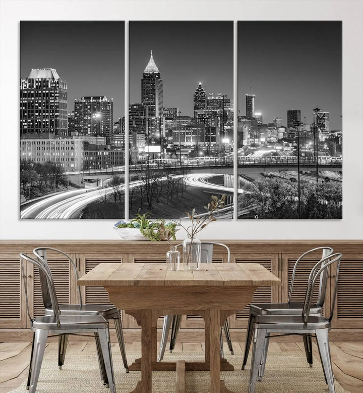 The living room is highlighted by an Atlanta Black and White Wall Art Cityscape Canvas Print that complements the black-and-white cityscape triptych on the wall, bringing an urban decor vibe to the space.