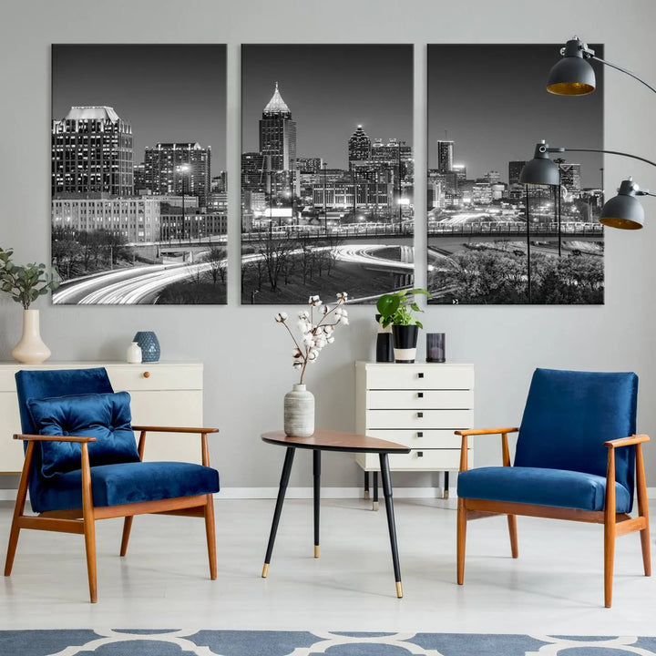 The living room is highlighted by an Atlanta Black and White Wall Art Cityscape Canvas Print that complements the black-and-white cityscape triptych on the wall, bringing an urban decor vibe to the space.