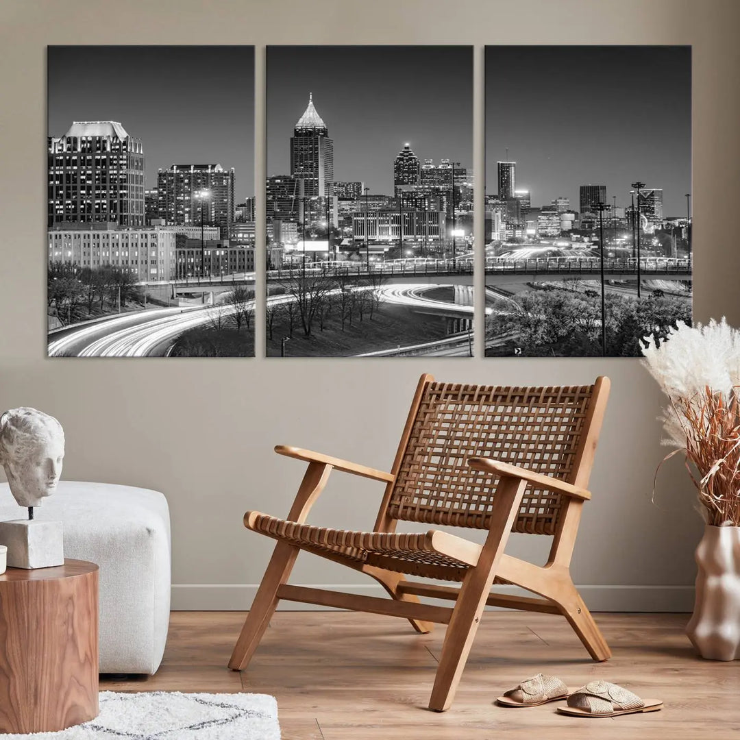 The living room is highlighted by an Atlanta Black and White Wall Art Cityscape Canvas Print that complements the black-and-white cityscape triptych on the wall, bringing an urban decor vibe to the space.