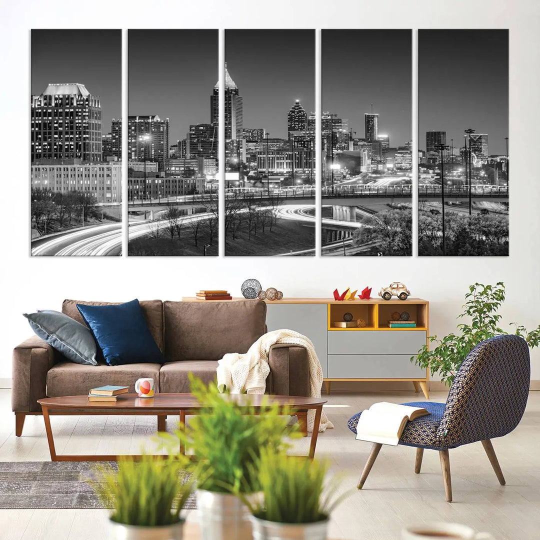 The living room is highlighted by an Atlanta Black and White Wall Art Cityscape Canvas Print that complements the black-and-white cityscape triptych on the wall, bringing an urban decor vibe to the space.