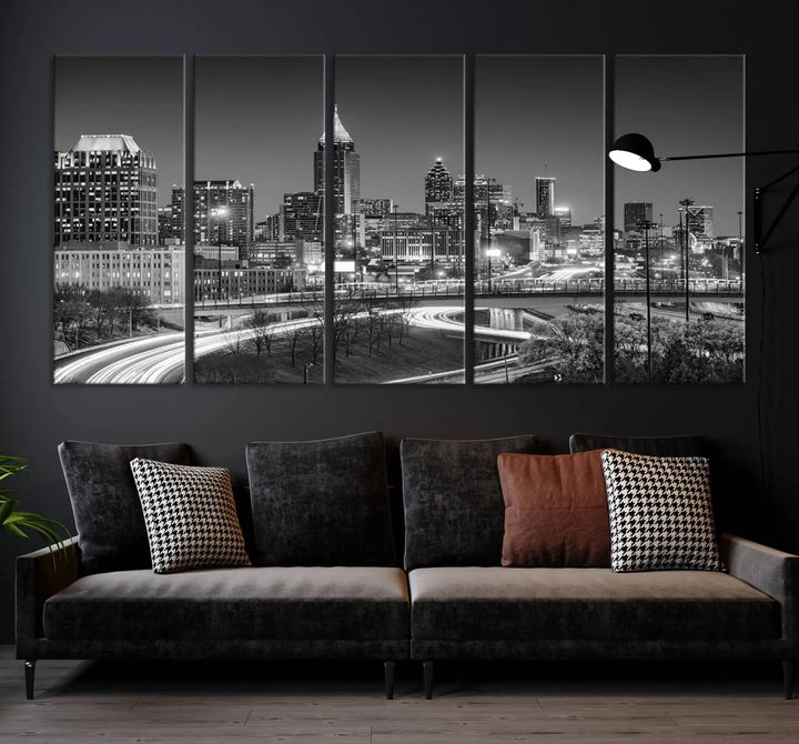 The living room is highlighted by an Atlanta Black and White Wall Art Cityscape Canvas Print that complements the black-and-white cityscape triptych on the wall, bringing an urban decor vibe to the space.