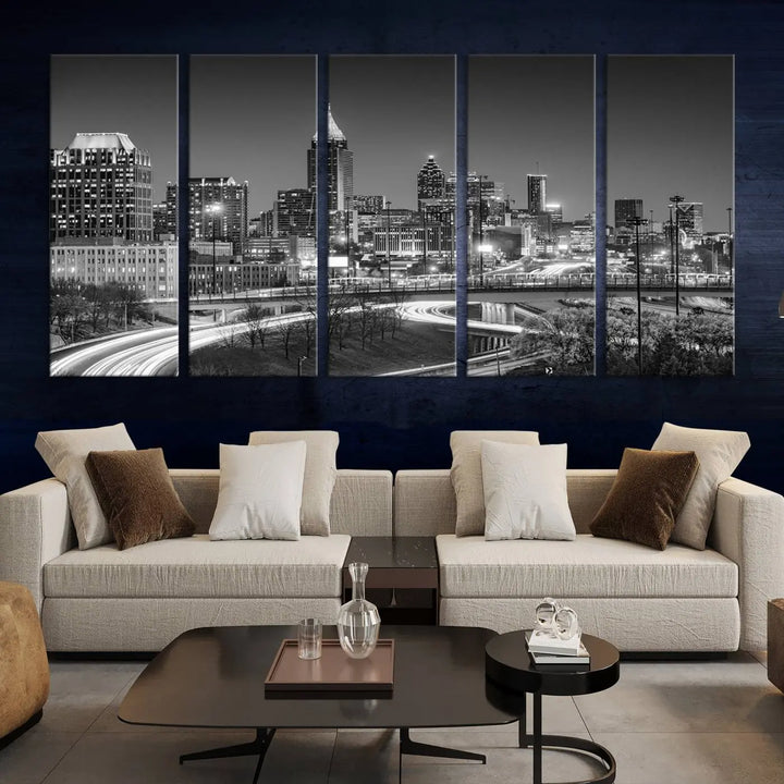 The living room is highlighted by an Atlanta Black and White Wall Art Cityscape Canvas Print that complements the black-and-white cityscape triptych on the wall, bringing an urban decor vibe to the space.